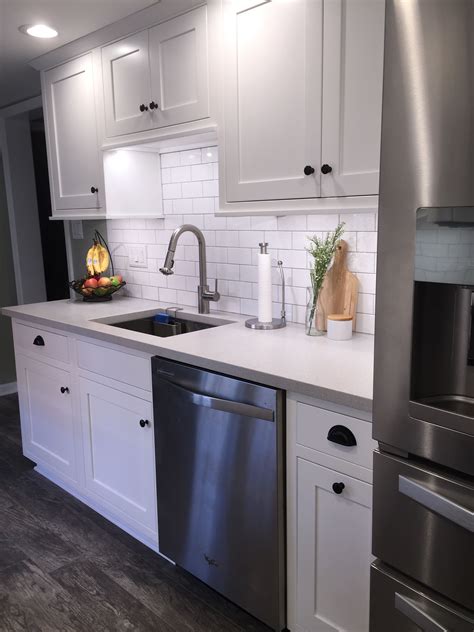 galley white cabinets stainless steel appliances|modern white galley kitchen.